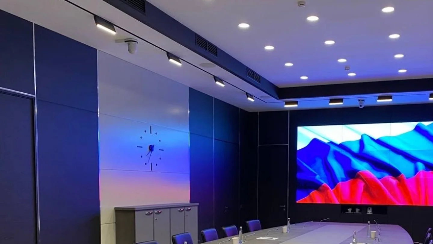 Executive conference room with a large multi-panel display wall